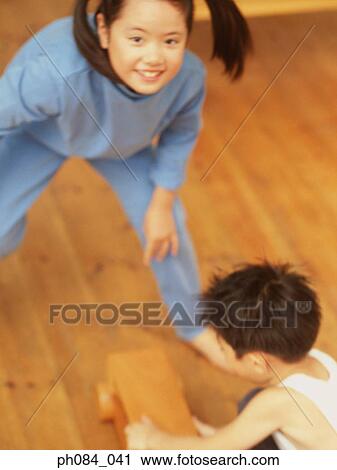 Sister and brother playing wooden toy car View Large Photo Image Stock Image - Sister and brother playing wooden toy car. Fotosearch