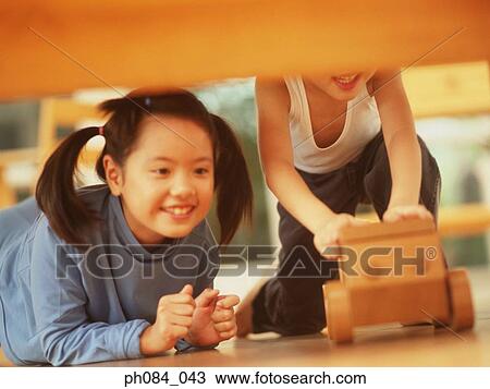 Sister And Brother Playing Wooden Toy Car Sister And Brother Playing Wooden Toy Car