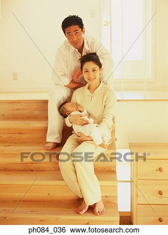 Young parents and a baby View Large Photo Image Stock Photograph - Young parents and a baby. Fotosearch