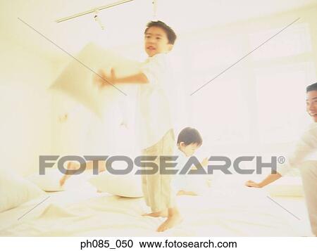 Children playing on bed View Large Photo Image Stock Image - Children playing on bed. Fotosearch