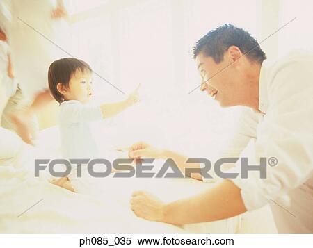 Father playing with son View Large Photo Image Stock Photography - Father playing with son. Fotosearch