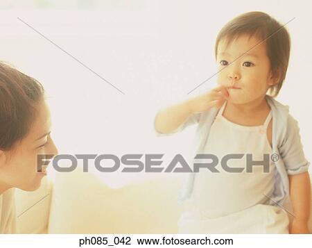 Mother and a young son View Large Photo Image Stock Image - Mother and a young son. Fotosearch