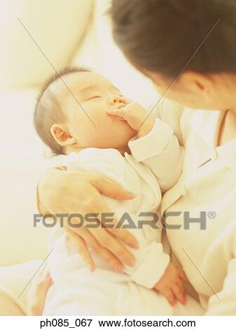 Mother holding baby View Large Photo Image Stock Photo - Mother holding baby. Fotosearch