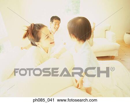 Parents and son playing View Large Photo Image Stock Image - Parents and son playing. Fotosearch