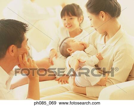 Stock Photo - Portrait of a happy family. Fotosearch