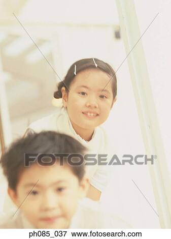 Stock Photo - Portrait of a young boy and girl. Fotosearch