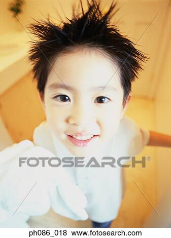 Boy with spiked hair, portrait, close-up View Large Photo Image Stock Photo - Boy with spiked hair, portrait, close-up . Fotosearch