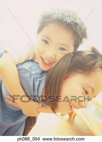 Brother hugging sister View Large Photo Image Picture - Brother hugging sister. Fotosearch