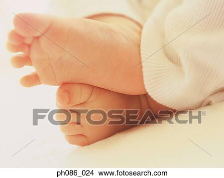 Close-up of baby's feet View Large Photo Image Picture - Close-up of baby's feet . Fotosearch
