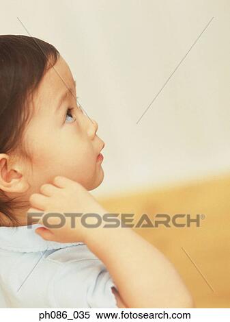 Little girl looking up, close-up View Large Photo Image Stock Photography - Little girl looking up, close-up. Fotosearch