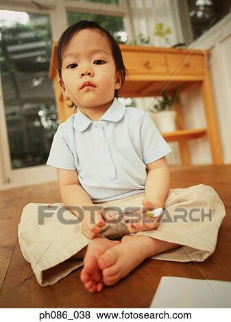Little girl sulk, holding a crayon View Large Photo Image Stock Photo - Little girl sulk, holding a crayon. Fotosearch