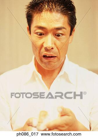 Man is staring open mouthed with an expression of disbelief View Large Photo Image Stock Photo - Man is staring open mouthed with an expression of disbelief . Fotosearch