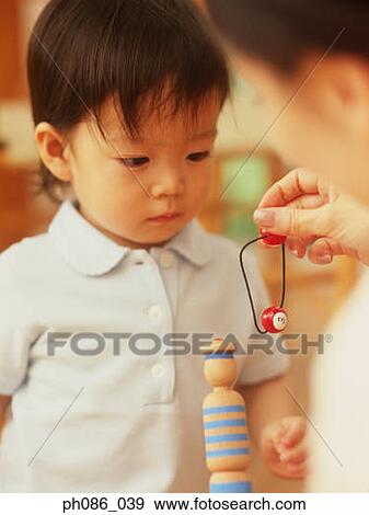 Mother and daughter playing toy View Large Photo Image Stock Photo - Mother and daughter playing toy. Fotosearch