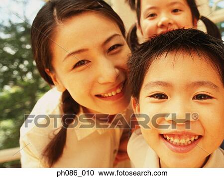 Stock Image - Portrait of a happy family. Fotosearch