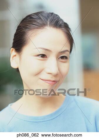 Portrait of a happy woman, close-up View Large Photo Image Stock Image - Portrait of a happy woman, close-up. Fotosearch