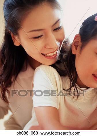 Portrait of mother and daughter View Large Photo Image Stock Photo - Portrait of mother and daughter. Fotosearch