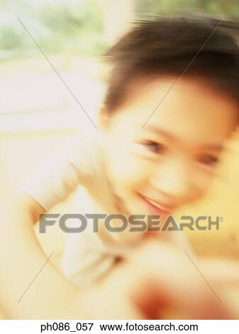 Portrait of young boy smiling, close-up View Large Photo Image Stock Photo - Portrait of young boy smiling, close-up. Fotosearch