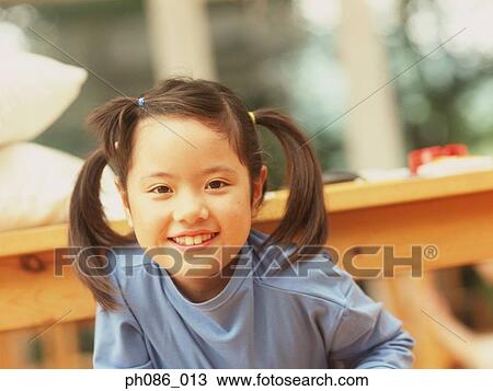 Portrait of young girl smiling View Large Photo Image Stock Image - Portrait of young girl smiling. Fotosearch