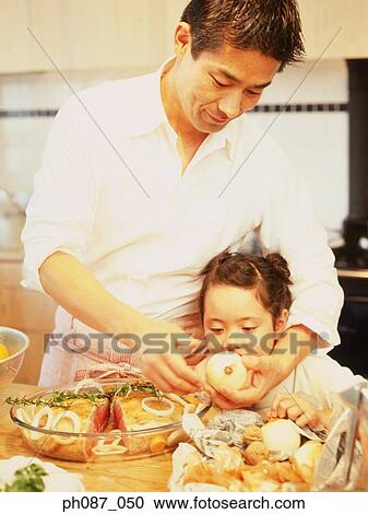 Father and daughter in kitchen preparing food View Large Photo Image Stock Image - Father and daughter in kitchen preparing food. Fotosearch