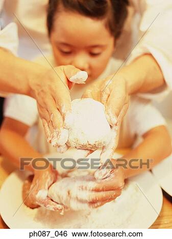 Father and daughter making dough View Large Photo Image Stock Photograph - Father and daughter making dough. Fotosearch