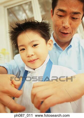 Father tying tie for son, close-up View Large Photo Image Stock Image - Father tying tie for son, close-up. Fotosearch