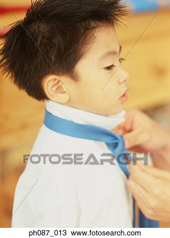Father tying tie for son, close-up View Large Photo Image Stock Image - Father tying tie for son, close-up. Fotosearch