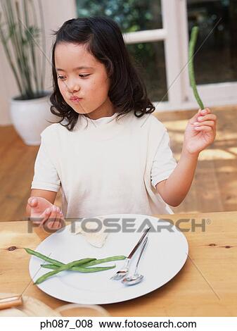 Little girl holding long beans View Large Photo Image Stock Photo - Little girl holding long beans. Fotosearch