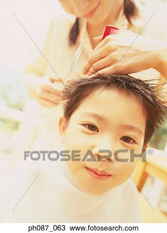 Mother cutting hair for son, close-up View Large Photo Image Stock Image - Mother cutting hair for son, close-up. Fotosearch