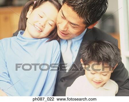 Stock Image - Portrait of father and children. Fotosearch