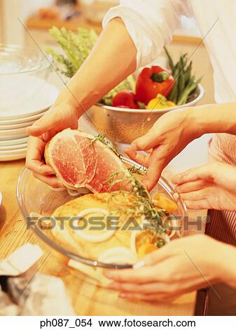 Preparation of food in kitchen View Large Photo Image Picture - Preparation of food in kitchen. Fotosearch