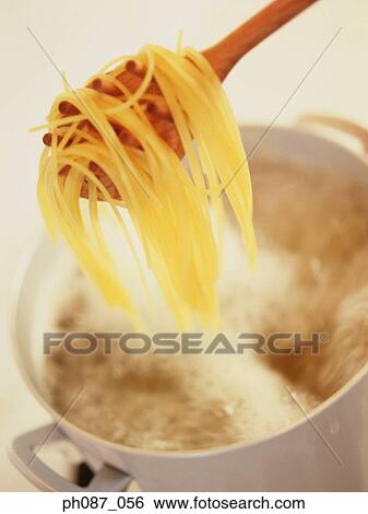 Taking pasta from pot View Large Photo Image Stock Photograph - Taking pasta from pot . Fotosearch