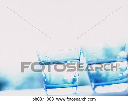 Two glasses of water, close-up View Large Photo Image Stock Image - Two glasses of water, close-up. Fotosearch