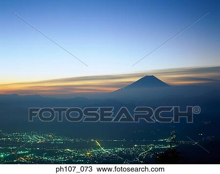 Japan, Mt Fuji, lighted city in foreground at night View Large Photo Image Stock Image - Japan, Mt Fuji, lighted city in foreground at night. Fotosearch