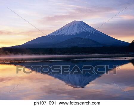 Japan, Mt Fuji, peak in pink winter sunlight, reflected in lake View Large Photo Image Stock Image - Japan, Mt Fuji, peak in pink winter sunlight, reflected in lake . Fotosearch