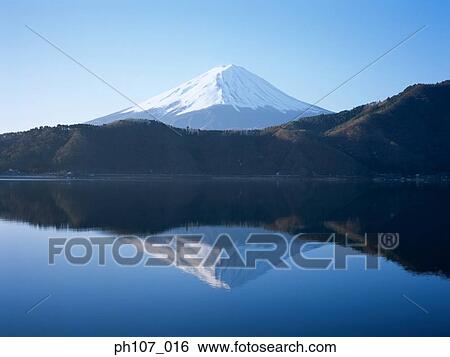Stock Photograph - Japan, Mt Fuji, reflected in lake . Fotosearch