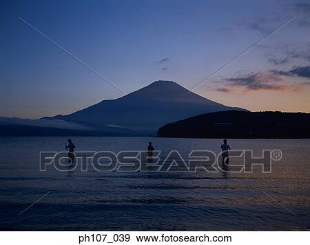 Three men fishing in lake, Mt. Fuji in background View Large Photo Image Stock Photo - Three men fishing in lake, Mt. Fuji in background. Fotosearch