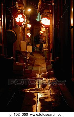 A small alley at night View Large Photo Image Stock Image - A small alley at night. Fotosearch