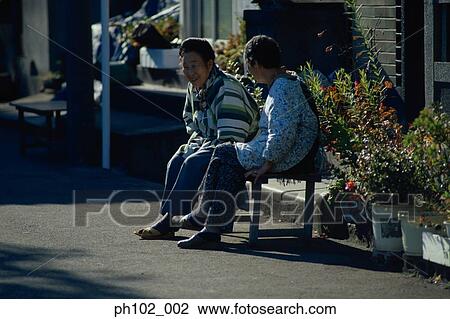 Two matured Japanese women chatting View Large Photo Image Stock Image - Two matured Japanese women chatting. Fotosearch
