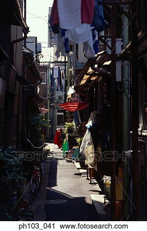 A small alley in the day View Large Photo Image Stock Image - A small alley in the day. Fotosearch