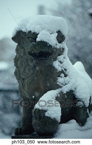A stone sculpture of a lion, partially covered with snow View Large Photo Image Stock Image - A stone sculpture of a lion, partially covered with snow. Fotosearch