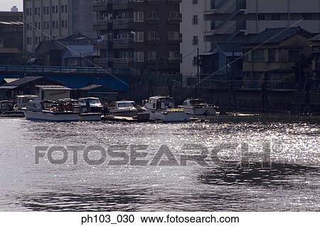 Boats dock in a small harbor View Large Photo Image Stock Image - Boats dock in a small harbor. Fotosearch