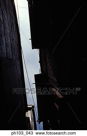 Elevated view of a small alley View Large Photo Image Stock Image - Elevated view of a small alley. Fotosearch