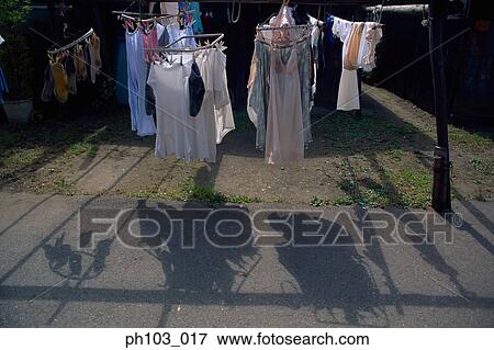 Laundry drying in the sun View Large Photo Image Stock Photo - Laundry drying in the sun. Fotosearch