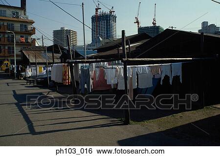 Laundry drying in the sun View Large Photo Image Stock Photograph - Laundry drying in the sun. Fotosearch