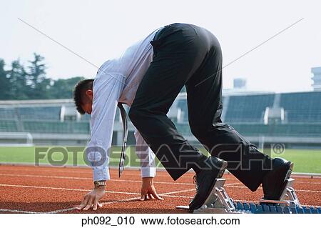 Businessman at starting block View Large Photo Image Stock Image - Businessman at starting block . Fotosearch