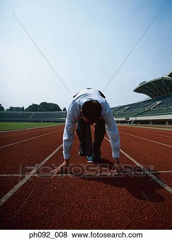 Stock Photo - Businessman at starting block . Fotosearch