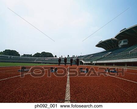 Businessman walking towards starting block View Large Photo Image Stock Image - Businessman walking towards starting block . Fotosearch