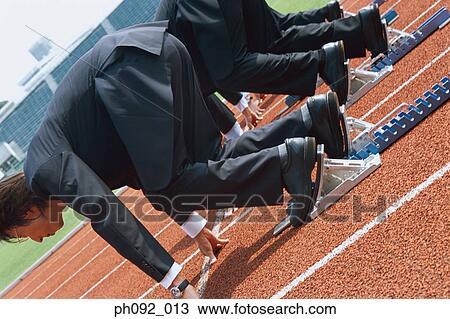 Stock Image - Businessmen at starting line . Fotosearch
