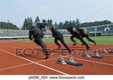 Picture - Businessmen leaving starting block . Fotosearch