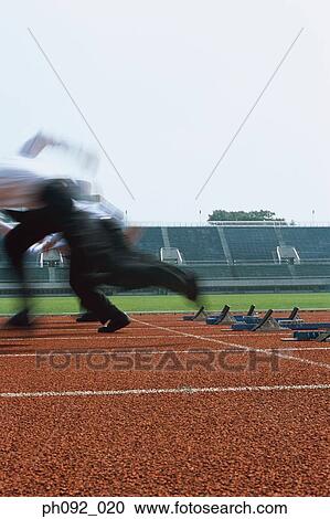 Businessmen leaving starting block View Large Photo Image Stock Image - Businessmen leaving starting block . Fotosearch